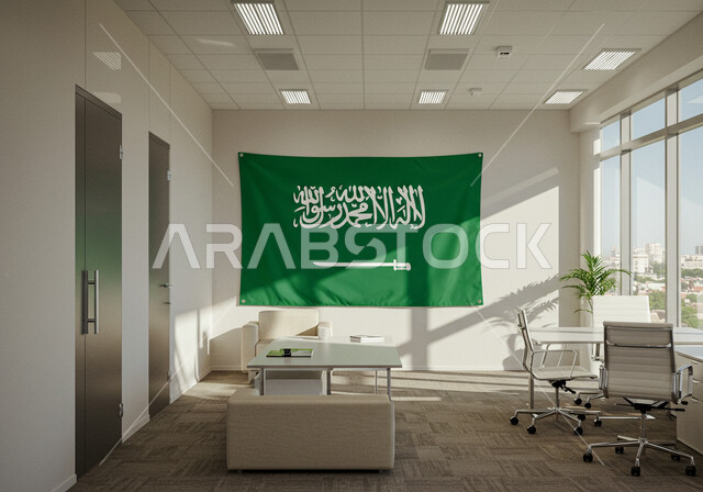 Office desk with large glass front, Flag Day March 11, Saudi National Day September 23, Saudi flag on wall in office room, concept of patriotism and belonging to the homeland, modern style interior design and decoration for offices of companies in the Kingdom