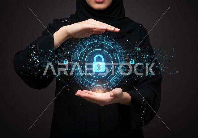 خطوط الاتصال والبرمجة الحاسوبية، تأمين المعلومات وحمايتها من الهجمات، بورتريه مقرب لامرأة عربية خليجية سعودية محجبة ترتدي عباءة سوداء تقوم بعرض عنصر هولوجرامي مضيء، مفهوم الامن السيبراني، رموز وعناصر هولوجراميه ثلاثية الابعاد لقفل الأمان، خلفية سوداء