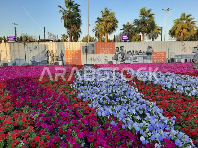 Environmental conservation and sustainable development, colorful rose fields and palm trees at the Flower and Garden Festival, a family, environmental, cultural and entertainment destination, distinctive design and decoration in Yanbu Industrial City Park, a natural tourism festival and exhibition in the Kingdom of Saudi Arabia
