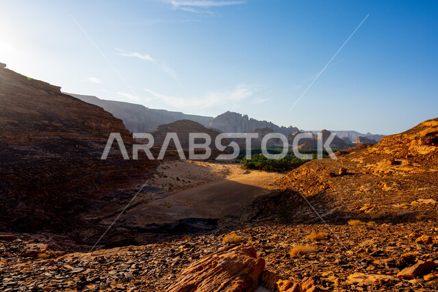 Natural mountain peaks and heights in the desert areas of AlUla, ancient historical monuments, rock formations and mountains amidst the sandy nature during the day, a famous tourist place and area in the Kingdom of Saudi Arabia