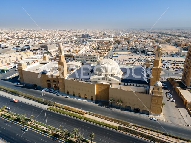 Roads, houses and residential homes, modern Islamic architectural art, a sacred religious place and landmark, Al Rajhi Mosque in the capital Riyadh, Kingdom of Saudi Arabia during the day, Muslims call to perform worship and duties
