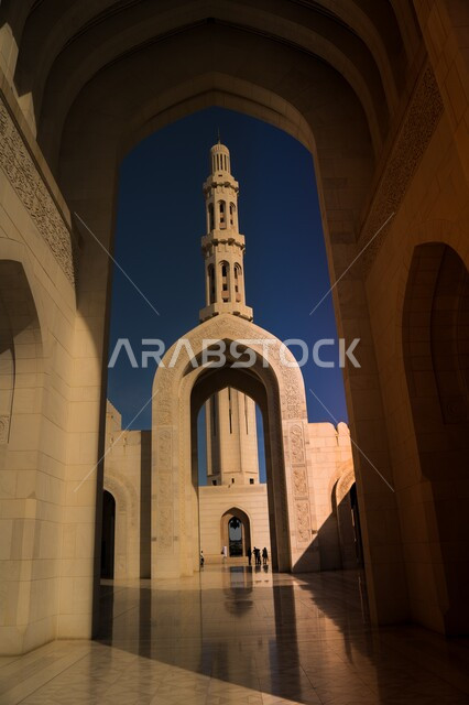 Islamic Arab architectural style, sacred religious places and landmarks, Sultan Qaboos Mosque in Muscat, Sultanate of Oman, Islamic architectural masterpieces in the capital, view of the sky at sunset, domes, minarets and decorated arches