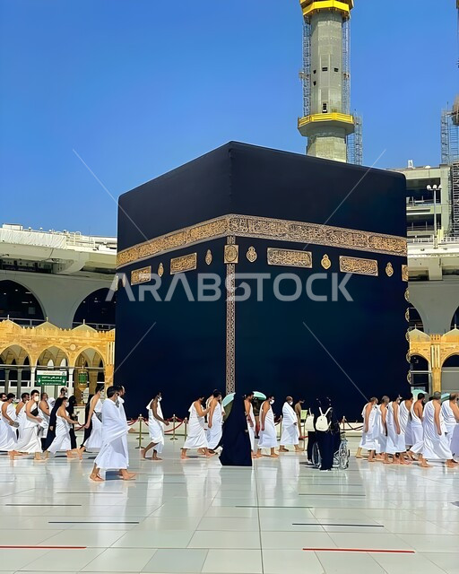 Pilgrims and Umrah performers circumambulate the Kaaba in Mecca, performing Hajj and Umrah rituals, destination of Muslims from all over the world, a sacred Islamic religious place and landmark in the Kingdom of Saudi Arabia, the concept of worship and drawing closer to God