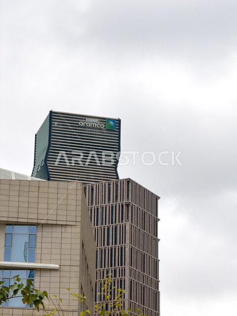 Modern and sophisticated architectural engineering art of Aramco Tower in King Abdullah Financial District (KAFD) in Riyadh, the main destination for finance and business, achieving economic and commercial renaissance, growth and urban progress of skyscrapers in the Kingdom of Saudi Arabia