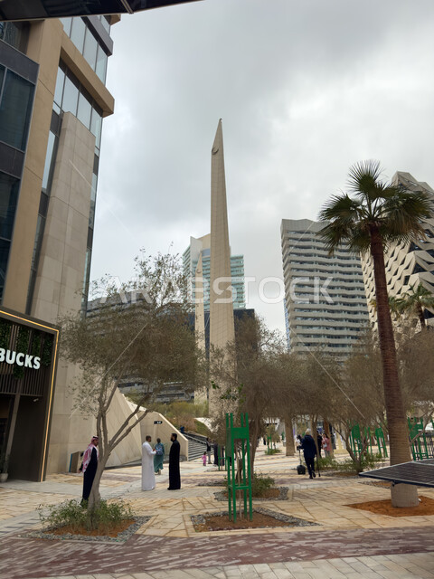 Modern architectural style of towers and skyscrapers, the exterior facade of Starbucks coffee shop in King Abdullah Financial City (KAFD) in Riyadh, urban growth and progress in the Kingdom of Saudi Arabia, achieving economic and commercial renaissance, the main destination for money and business