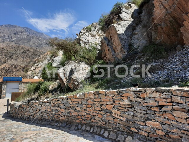 A distinctive mountain landscape in Al Bahah region in the Kingdom of Saudi Arabia, the rock formation and formation of the mountainous height, the ancient marble village in Dhi Ain, a famous tourist landmark, a place of attraction and attraction for tourists