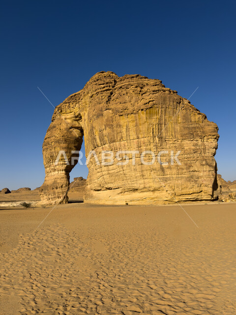 Elephant Rock in AlUla Governorate during the day, a famous natural tourist place, the terrain in the peaks and mountain heights, enjoying the deserts of the Kingdom, an ancient historical archaeological landmark, mountains and rock formations in desert areas