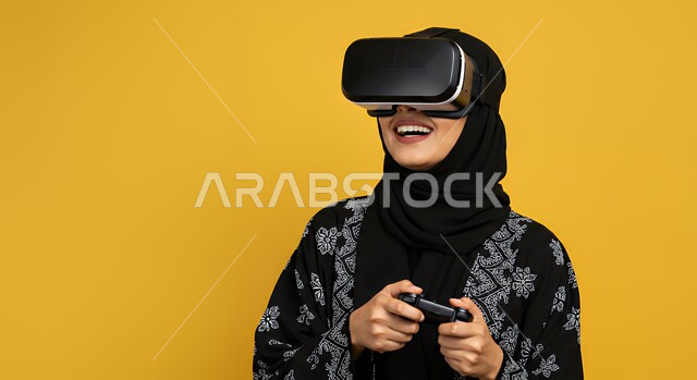 Merging fun and entertainment with the virtual world, a technological device and modern technology, a close-up portrait of a young Saudi Arabian Gulf woman wearing a hijab, an abaya, and VR glasses, holding a joystick in her hand, playing recreational video games, expressions of pleasure and happiness, spending enjoyable free time, yellow background