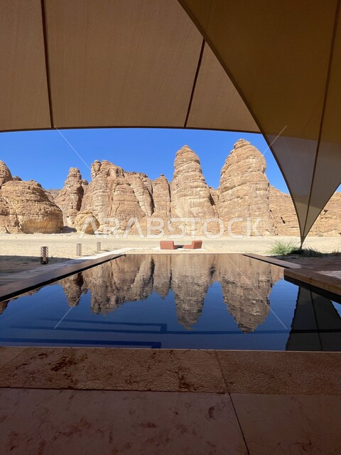 Recreation and relaxation in nature, a swimming pool in the middle of the desert of AlUla, the terrain and mountainous heights in the desert areas, natural tourist attractions in the Kingdom of Saudi Arabia, a famous natural tourist place