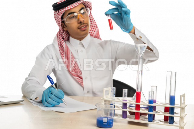 Portrait of a Saudi Arabian Gulf university student wearing traditional Gulf dress, sitting in a chemistry lab, using test tubes to conduct experiments in the laboratory, chemical reactions, recording results and notes, research and development, the conce