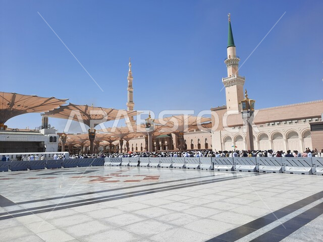 The outer courtyard of the Prophet's Mosque in Medina, Saudi Arabia, attracts Muslims from all over the world, Islamic holy places, a sacred religious landmark during the day