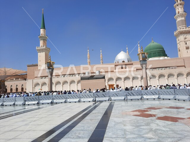 The outer courtyard of the Prophet's Mosque in Medina, Saudi Arabia, attracts Muslims from all over the world, Islamic holy places, a sacred religious landmark during the day
