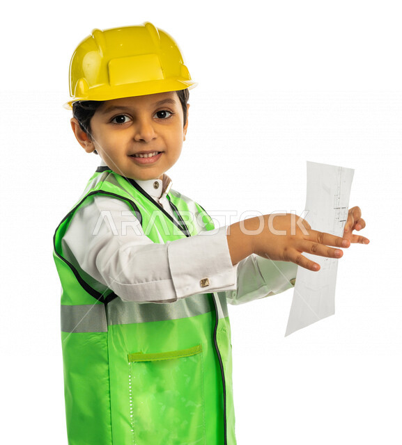 Portrait of a Saudi Arabian Gulf boy wearing a protective helmet and work protection jacket, holding in his hand a chart paper with different face and hands gestures, future profession, white background, engineering concept, engineering professions and jo