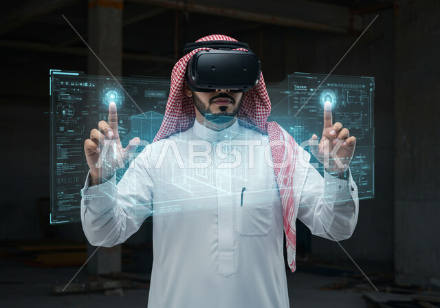 رؤية مستقبلية سعودية 2030، التفاعل مع الهندسة الافتراضية، رجل عربي خليجي سعودي يرتدي الثوب التقليدي والشماغ ونظارة الواقع الافتراضي يتفاعل مع مجسم هولوجرامي لمبنى، نمو وتطور المجال الهندسي عبر نظارة الفي آر، مجسمات للمنشآت والمباني المعمارية