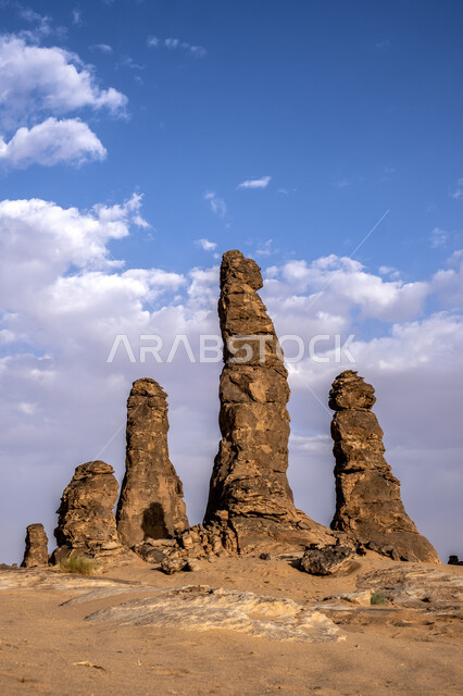 Rocky nature of mountains in the desert during the day, terrain and mountain heights in desert areas, natural tourist attractions in the Kingdom of Saudi Arabia, a famous natural tourist place