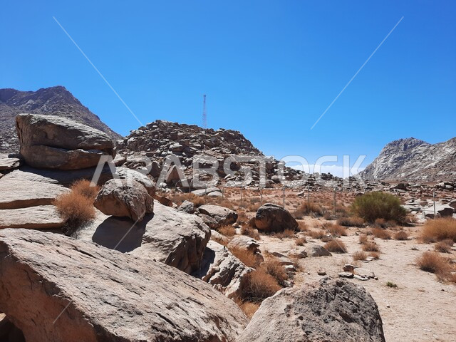 Natural rock formations in desert areas, mountain peaks and heights in Tabuk city in the Kingdom of Saudi Arabia, ancient historical monuments, tourist attractions in Saudi Arabia, Mount Sinai during the day