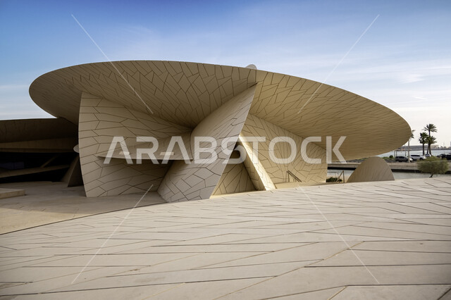 Modern architectural art, the geometric formation of the Qatar National Museum building on the Doha Corniche, famous landmarks, museums and palaces in Qatar, urban growth and progress, tourist attractions and attractions to learn about Qatari heritage and civilization