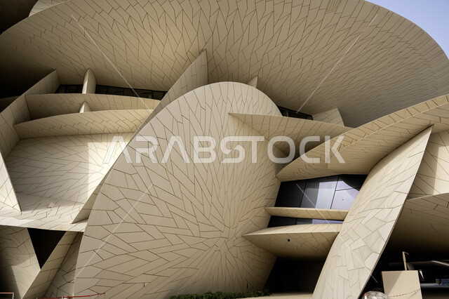 Modern architectural art, the geometric formation of the Qatar National Museum building on the Doha Corniche, famous landmarks, museums and palaces in Qatar, urban growth and progress, tourist attractions and attractions to learn about Qatari heritage and civilization