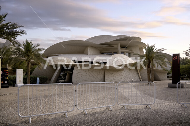 Modern architectural art, the geometric formation of the Qatar National Museum building on the Doha Corniche, famous landmarks, museums and palaces in Qatar, urban growth and progress, tourist attractions and attractions to learn about Qatari heritage and civilization