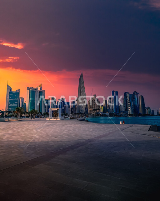 Modern buildings and towers in Doha at sunset, urban growth and development and civilizational progress in the State of Qatar, architectural art in the construction of skyscrapers and high-rise hotels