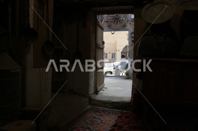 Old Arabic architectural style, famous historical landmarks and heritage sites, simple mud houses and buildings, a brick house in one of the popular neighborhoods in the villages of the Kingdom of Saudi Arabia