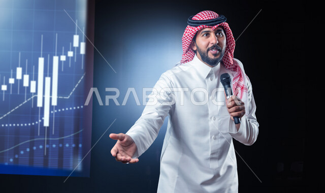 رجل عربي سعودي خليجي يلقي محاضرة عن البورصه،  تقديم العروضات المسرحية ، القاء الخطابات ، الحوارات و النقاشات ، اداء تمثيلي ، ايماءات وجه و يدين مختلفة ، الفن المسرحي