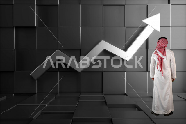 رجل عربي خليجي سعودي يقف امام حائط عليه مؤشر صعود السهم ، النجاح في التداول المالي ، متابعة الرسم البياني لسوق الاوراق المالية، مراقبة صعود ونزول البورصة المالية ، الاستثمار والتداول في البورصة ، الاقتصاد والنمو المالي