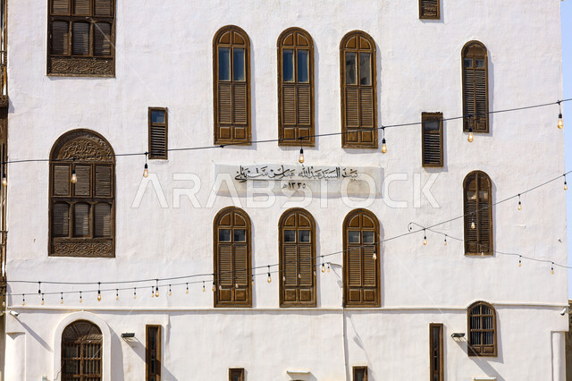 Old windows in the historic city of Jeddah, ancient Arab and Islamic architectural design, historic houses in the historic city of Jeddah, popular heritage tourist sites in the Kingdom of Saudi Arabia, historical landmarks in the Al-Balad district