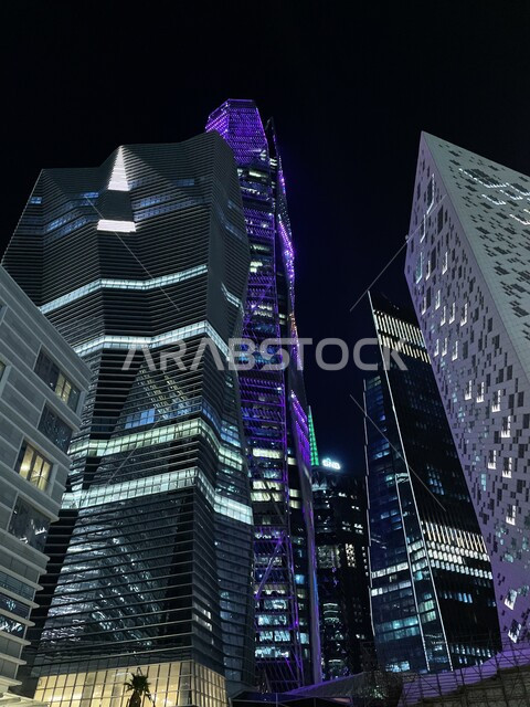 King Abdullah Financial District (KAFD) at night, towers and financial facilities in Riyadh, urban development and growth in Saudi Arabia, the architectural art of the famous buildings and skyscrapers in the Kingdom, the prosperity and achievement of economic and commercial renaissance