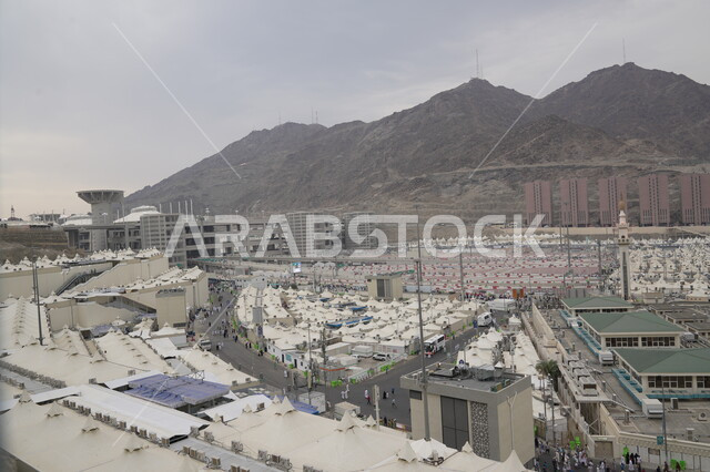 The concept of worship and drawing closer to God, pilgrims and Umrah performers in Mecca in Mina, performing Hajj rituals on the Day of Arafah, a destination for Muslims from all over the world, a sacred Islamic religious place and landmark in the Kingdom of Saudi Arabia