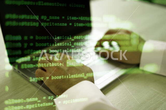 A Saudi Arabian Gulf man using a laptop, working as a web developer, using programming languages, developing and building websites and electronic applications, the ability to penetrate device protection, codes and algorithms, techniques and computer