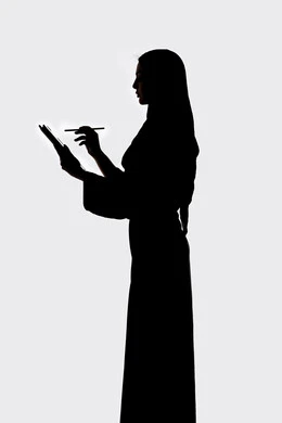 Using modern technology, conducting a live broadcast, completing work tasks remotely, social media, integrating modern technology into daily life, taking souvenir selfies using a tablet, a silhouette of an Arab Gulf Emirati woman, white background