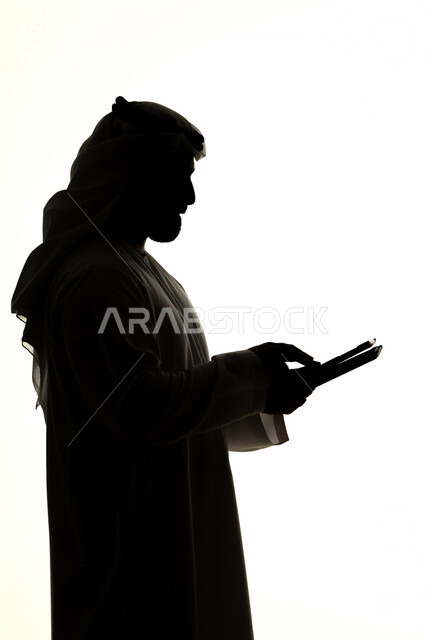 Tablet applications and programs, online shopping using a tablet, completing tasks remotely, integrating modern technologies into daily life, silhouette of an Arab Gulf Emirati man, professions and jobs, white background