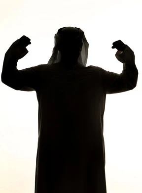 Muscle display, healthy body, fitness and health, physical strength display, silhouette of an Arab Gulf Emirati man, raising his hand with a clenched fist, muscular strength, white background