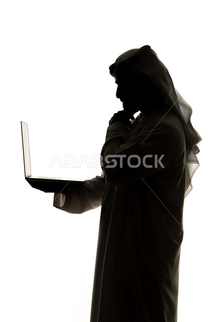 Use of technology devices, integration of modern technologies into daily life, silhouette of an Arab Gulf Emirati man, using a laptop, surfing the internet, remote work, e-marketing, professions and jobs, white background