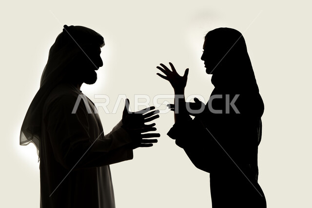 Family problems, misunderstanding, crisis in family relations, silhouette of an Arab Gulf Emirati couple, arguing with each other, quarrel between spouses, family conflict, white background