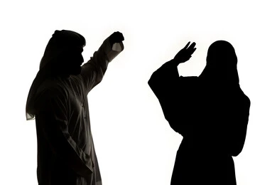 Misunderstanding, family problems, crisis in family relations, silhouette of an Arab Gulf Emirati couple, arguing with each other, quarrel between spouses, family conflict, white background