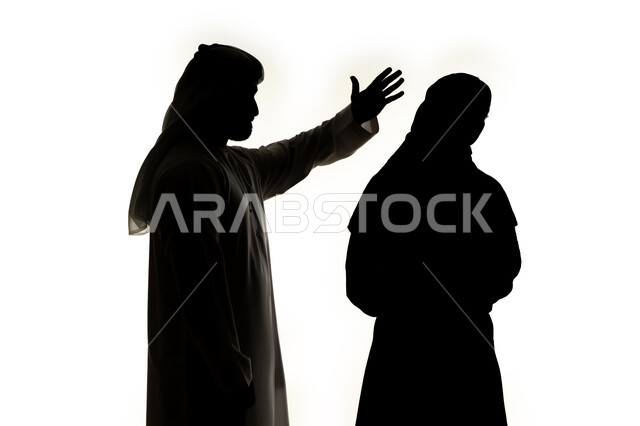 The concept of violence against women, a quarrel between spouses, a crisis in family relations, arguments and misunderstandings in the family, family problems and conflicts, a silhouette of an Arab Gulf Emirati couple, quarreling with each other, family conflict, white background