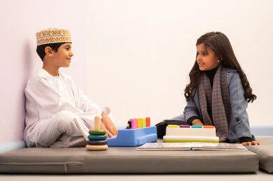 Games of fun and entertainment, performing many enjoyable activities, kindergartens and nurseries, two Omani children engaging in various activities, spending wonderful times at the amusement park, enjoyment during the summer vacation. Games of fun and entertainment, performing many enjoyable activities, kindergartens and nurseries, two Omani children engaging in various activities, spending wonderful times at the amusement park, enjoyment during the summer vacation.