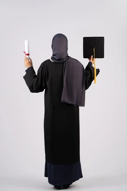 End of university studies, achieving dreams and success, excellence, diligence and seriousness, close-up portrait from the back of a veiled Saudi Arabian Gulf young woman wearing graduation attire holding a diploma and cap, an Emirati graduate celebrating her graduation from university, full body, white background