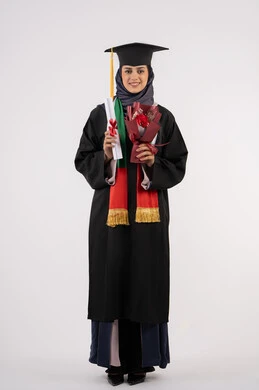 Looking at the camera with an expression of pleasure, a university occasion and celebration, celebrating the completion of university studies, gestures of happiness for reaching the dream of success, a portrait of a veiled Arab Gulf Emirati female graduate wearing a graduation gown and cap, holding a bouquet of flowers and a certificate, full body, white background