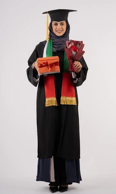 Celebrating the completion of university studies, giving gifts on occasions, university occasion and celebration, gestures of happiness for reaching the dream of success, portrait of a veiled Arab Gulf Emirati graduate wearing graduation dress and cap, holding a gift box with a bouquet of flowers, full body, white background