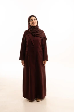 Beauty and attention to appearance, the concept of femininity and softness, gestures of joy and happiness, a portrait of a Saudi Arabian Gulf woman standing upright with expressions of self-confidence and looking at something, full-body, white background.