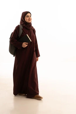 Education and learning in Saudi colleges, gestures of walking and going to university, a portrait of a Gulf Arab Saudi female university student wearing a hijab, an abaya, and a backpack holding university books in her hands, educational academies in the Gulf countries, full-body image, white background.