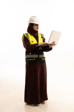 Integrating work with technology and tech, electronic supervision of the implementation of architectural engineering projects and plans in construction, a portrait of a Gulf Arab Saudi engineer wearing a jacket and a safety helmet using a laptop, full-body, white background.