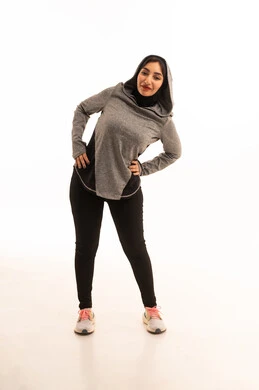 A healthy and beneficial lifestyle, the concept of fitness and agility, women's physical activities, muscle strengthening and body sculpting, a portrait of a young Arab Gulf Saudi woman wearing sportswear practicing exercises, white background.