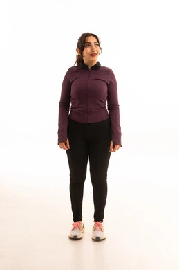 A healthy and beneficial lifestyle, the concept of agility and fitness, gestures of joy and happiness, women's physical activities, muscle strengthening and body sculpting, a portrait of a young Arab Gulf Saudi woman wearing sportswear looking at something, white background.