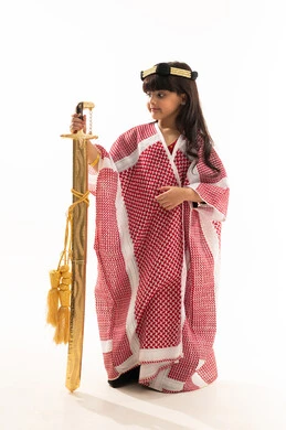 Traditional costumes on Saudi National Day, September 23, pride in Saudi heritage, the day we started in 1727 AD, portrait of a smiling Saudi Arabian Gulf girl holding a sword and wearing a bisht and agal, the founding day of the first Saudi state on February 22, full-length body, white background