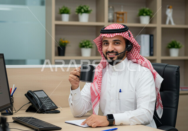 Customer service concept, information and communication department, answering questions and inquiries, a Saudi Arabian Gulf man wearing a traditional shemagh and thobe, wearing headphones and holding a cup of coffee, office jobs and professions, integrating work with technology and computers