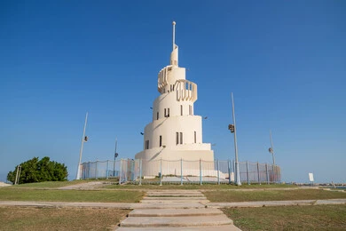 The Malwiya Tower on the artificial coral island in the Arabian Gulf, a family entertainment destination and a unique tourist destination to attract tourists to the Kingdom of Saudi Arabia, architectural artworks amidst the marine nature, the waterfront and Dammam Corniche during the day